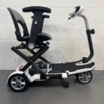 Photo of the Right Side of a White and Black Tga Minimo Second-hand Mobility Scooter. Tga Minimo