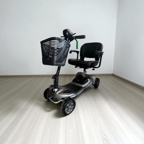 Photo showing a three-quarter view of the left side and front of a black and grey, Motion Healthcare Alumina Second hand mobility scooter.