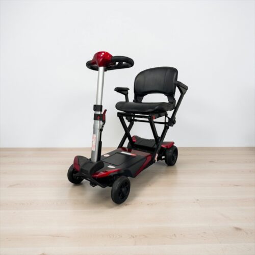 Photo showing a three-quarter view of the left of a Red, Solax Autofold Second hand mobility scooter.