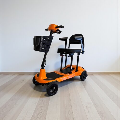 Photo showing a three-quarter view of the left of an Orange, Monarch Genie Ultralight Second hand mobility scooter.