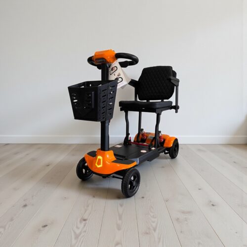 Photo showing a three-quarter view of the left of an Orange, Monarch genie Autofold Second hand mobility scooter.