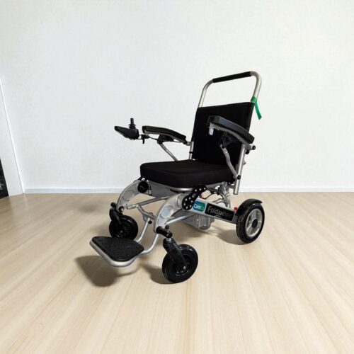 Photo showing a three-quarter view of the left side and front of a Silver, Careco Foldawheel Second hand Powerchair.