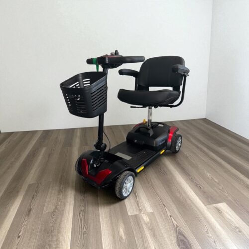 Photo showing a three-quarter view of the left side and front of a Red & Black, Careco X-Go Cosmic Second hand mobility scooter.