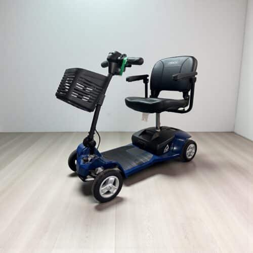 Photo showing a three-quarter view of the left side and front of a Blue, Pride Apex Alumalite Second hand mobility scooter.