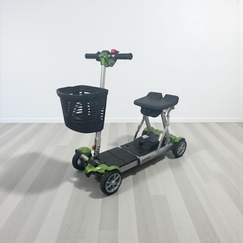 Photo showing a three-quarter view of the left of a green, Careco Minimus Second hand mobility scooter.
