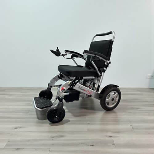 Photo showing a three-quarter view of the left side and front of a Silver, Freedom Chair A06L Second hand Powerchair.
