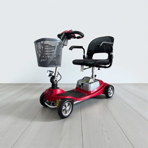 Photo showing a three-quarter view of the left of a Red, One Rehab Illusion Second hand mobility scooter.