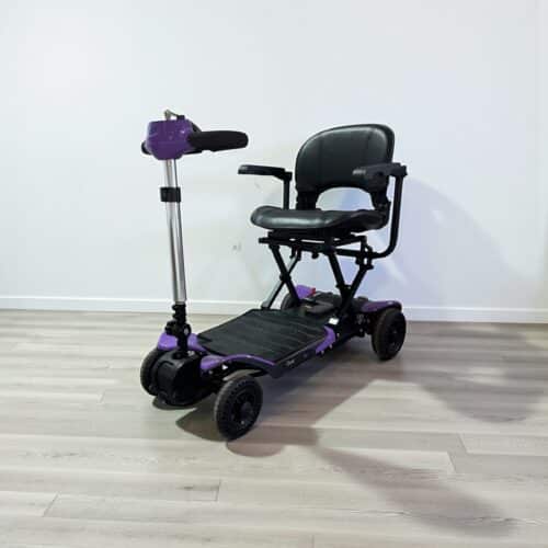 Photo showing a three-quarter view of the left of a Purple, Easy Living iGlide Autofold Second hand mobility scooter.