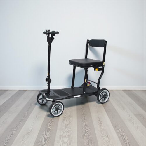 Photo showing a three-quarter view of the left of a Black, eFoldi Compass mobility scooter.
